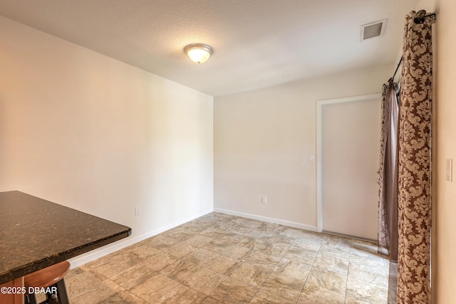2017 Cornell Pl, Port Orange, FL 32128 - unfurnished room featuring baseboards and stone finish flooring