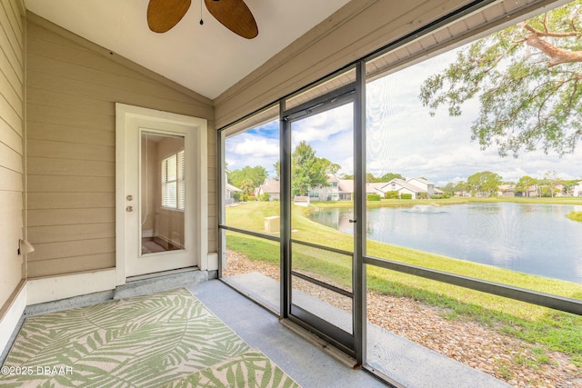 2017 Cornell Pl, Port Orange, FL 32128 - unfurnished sunroom featuring ceiling fan, a water view, vaulted ceiling, and a residential view