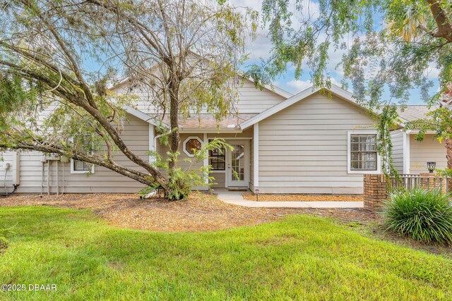 2017 Cornell Pl, Port Orange, FL 32128 - view of front of house with a front yard and roof with shingles