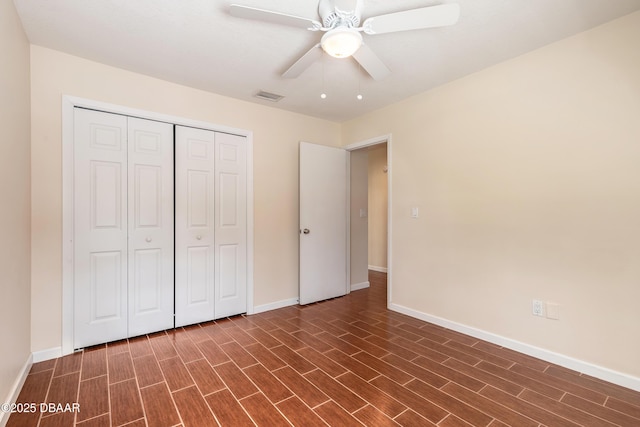 2017 Cornell Pl, Port Orange, FL 32128 - unfurnished bedroom with a closet, dark wood-style floors, and a ceiling fan