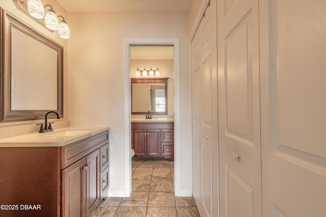 2017 Cornell Pl, Port Orange, FL 32128 - bathroom with a closet, vanity, and tile patterned flooring