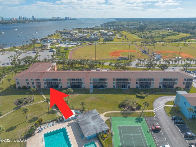 birds eye view of property with a water view