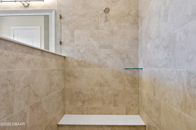 bathroom with a tile shower