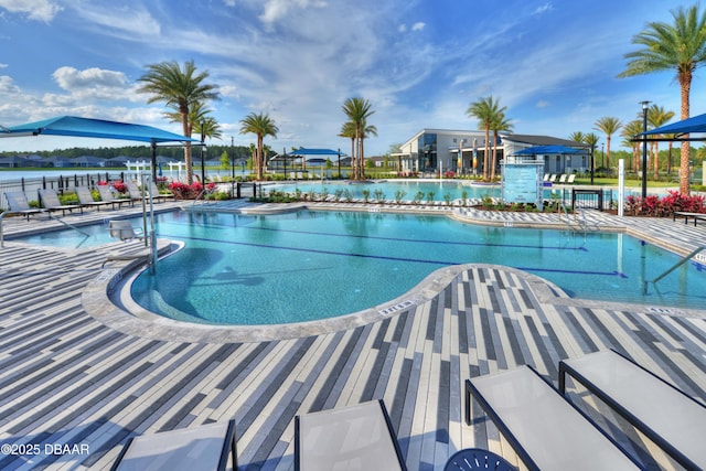 community pool featuring a patio area and fence