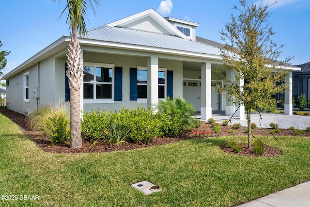 view of front of house with a front yard and covered porch