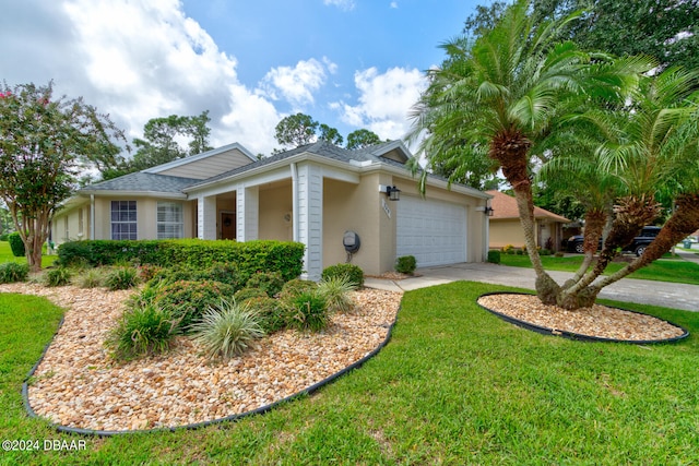 ranch-style house featuring a garage and a front yard