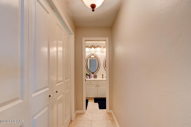 corridor with light tile patterned floors