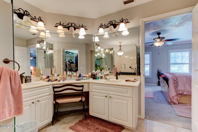 bathroom featuring tile patterned flooring, vanity, and ceiling fan