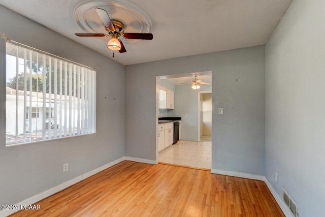 unfurnished living room featuring light hardwood / wood-style floors and ceiling fan