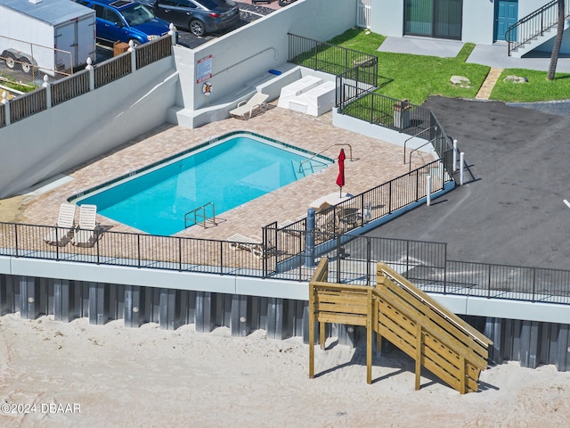 view of swimming pool featuring a patio