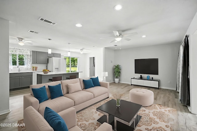 1101 8th St, Daytona Beach, FL 32117 - living room with ceiling fan, plenty of natural light, light wood finished floors, and recessed lighting