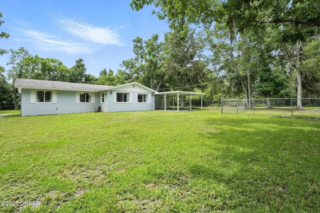1101 8th St, Daytona Beach, FL 32117 - view of yard with a carport and view of wooded area
