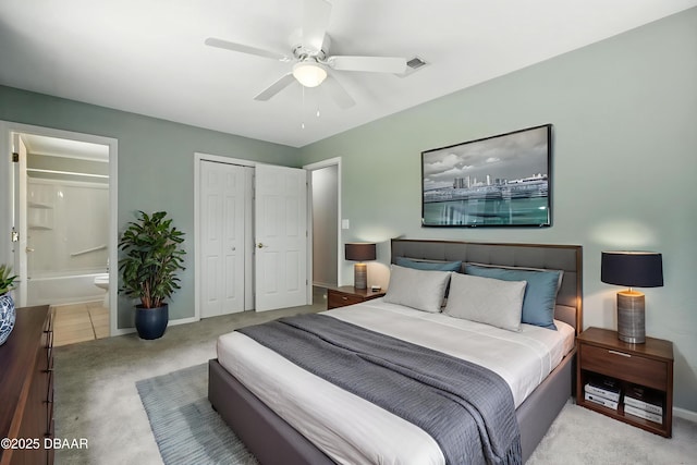 1101 8th St, Daytona Beach, FL 32117 - carpeted bedroom featuring ensuite bath, a closet, and a ceiling fan