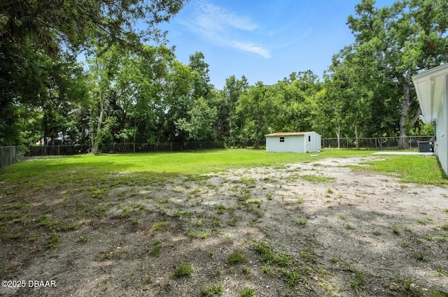 1101 8th St, Daytona Beach, FL 32117 - fenced backyard with a storage unit and a forest view