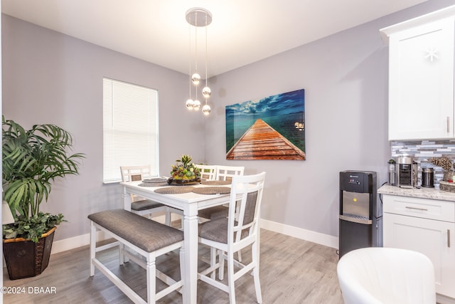 dining room with light hardwood / wood-style floors