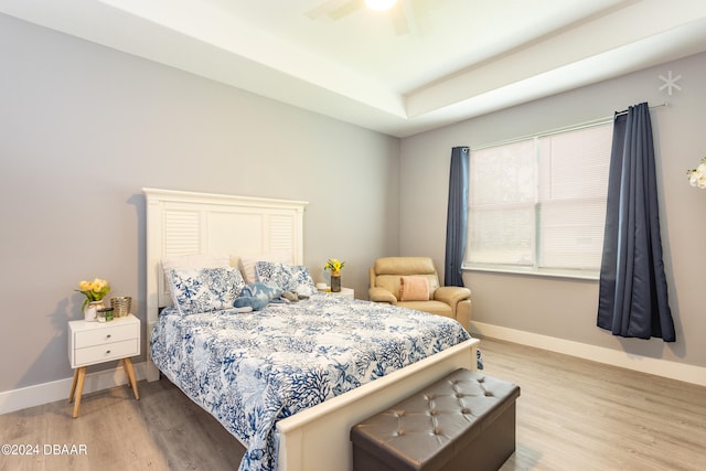 bedroom with ceiling fan and wood-type flooring