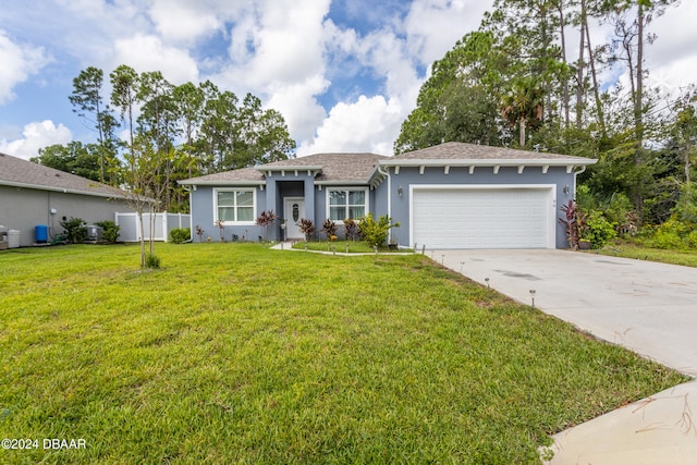 ranch-style house featuring a garage and a front yard