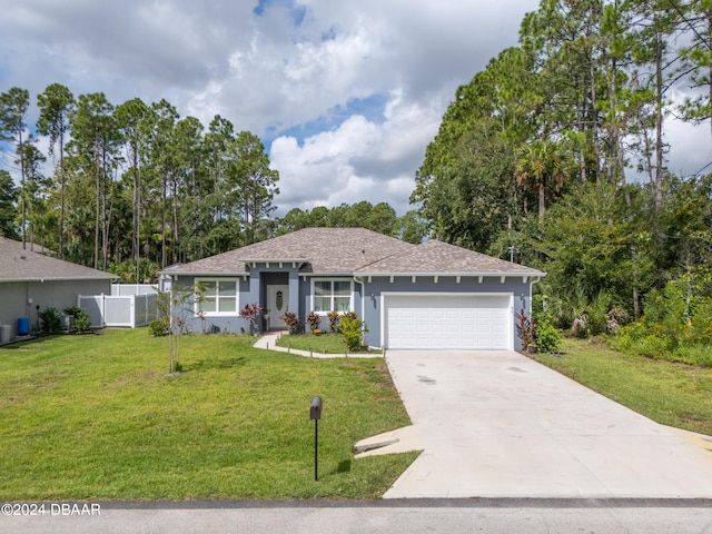 single story home featuring a garage and a front lawn