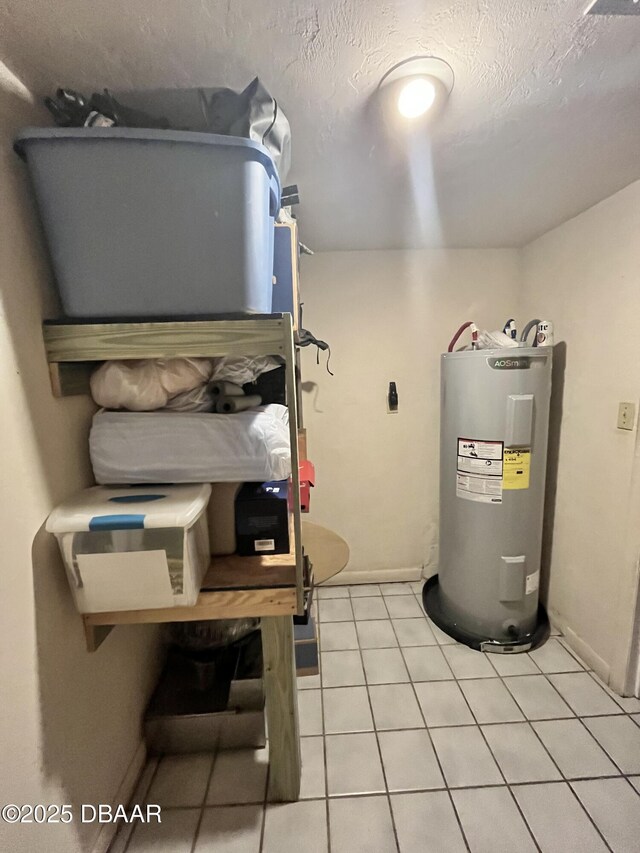 utility room featuring water heater