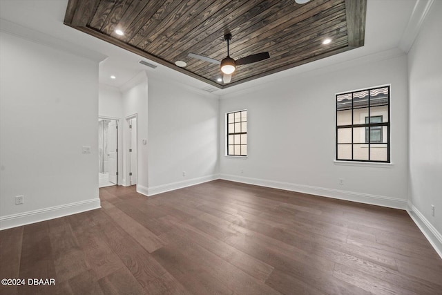 43 Del Palma Dr, Palm Coast, FL 32137 - spare room featuring dark wood finished floors, crown molding, baseboards, a tray ceiling, and ceiling fan