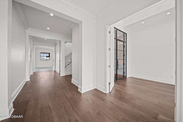 43 Del Palma Dr, Palm Coast, FL 32137 - corridor featuring dark wood finished floors, ornamental molding, baseboards, and recessed lighting