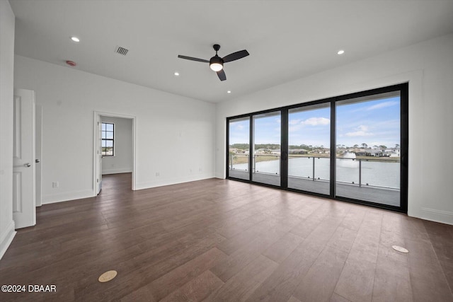 43 Del Palma Dr, Palm Coast, FL 32137 - empty room featuring healthy amount of natural light, dark wood-type flooring, a ceiling fan, and recessed lighting