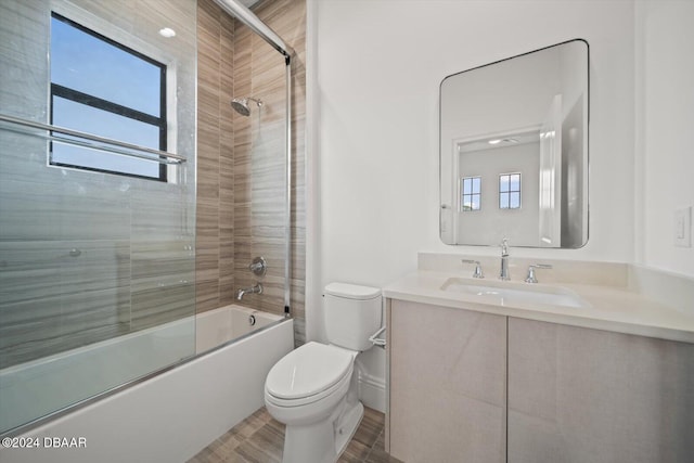 43 Del Palma Dr, Palm Coast, FL 32137 - full bathroom featuring toilet, bath / shower combo with glass door, and vanity