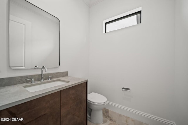 43 Del Palma Dr, Palm Coast, FL 32137 - bathroom featuring vanity, toilet, marble look tiles, and crown molding