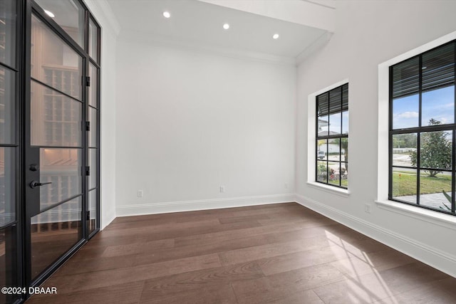 43 Del Palma Dr, Palm Coast, FL 32137 - empty room featuring dark wood-type flooring, ornamental molding, baseboards, and recessed lighting