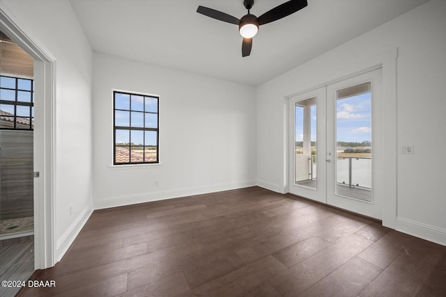 43 Del Palma Dr, Palm Coast, FL 32137 - spare room with french doors, dark wood-style flooring, and baseboards