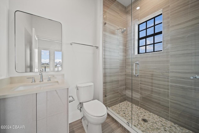 43 Del Palma Dr, Palm Coast, FL 32137 - bathroom with toilet, a shower stall, vanity, and baseboards