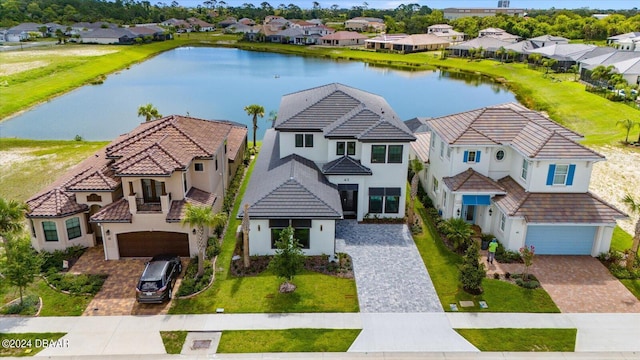 43 Del Palma Dr, Palm Coast, FL 32137 - view of front of home featuring a residential view, stucco siding, driveway, and a water view