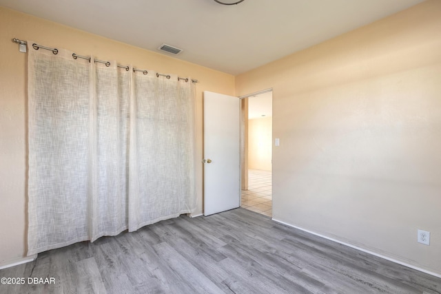 unfurnished bedroom featuring light hardwood / wood-style floors