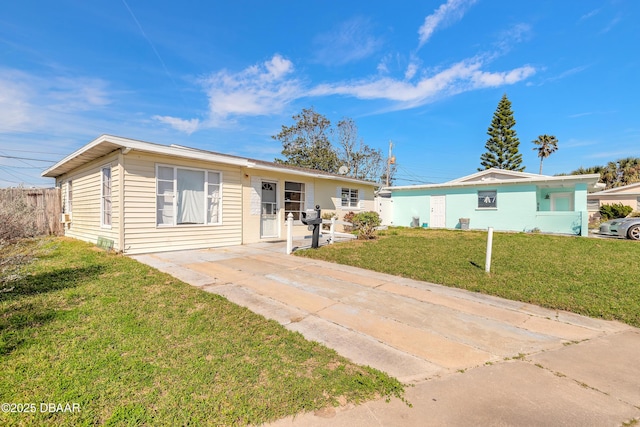 ranch-style home with a front lawn