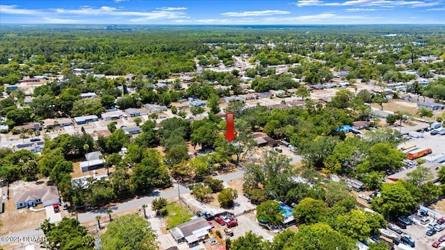 aerial perspective of suburban area with a heavily wooded area