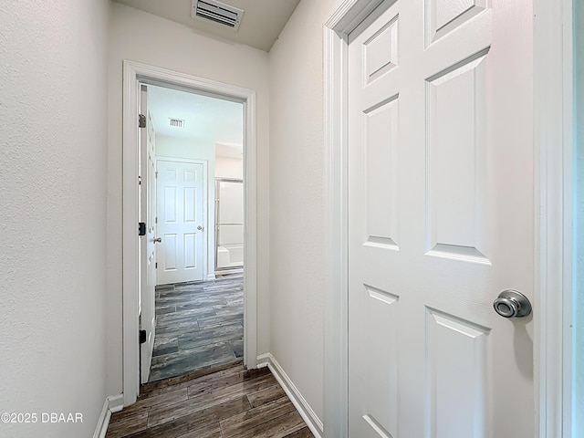 153 Orient Dr, Saint Augustine, FL 32092 - corridor with dark wood-style flooring and baseboards