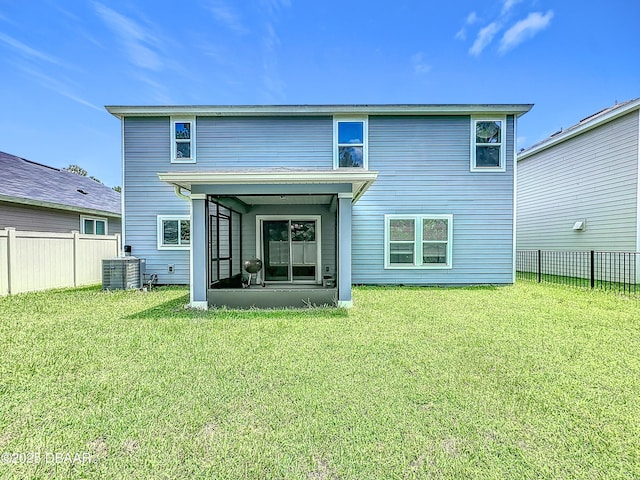 153 Orient Dr, Saint Augustine, FL 32092 - back of property with a sunroom and a fenced backyard