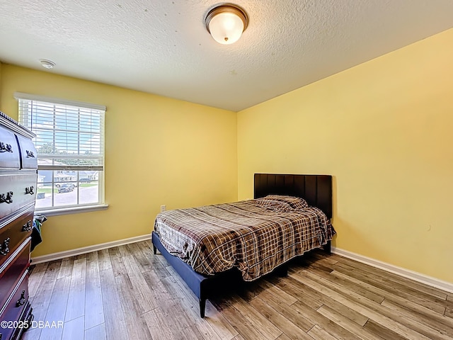 153 Orient Dr, Saint Augustine, FL 32092 - bedroom featuring wood finished floors and a textured ceiling