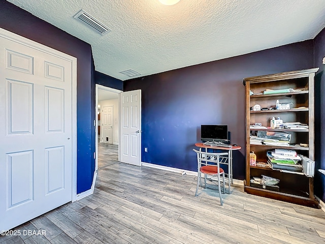153 Orient Dr, Saint Augustine, FL 32092 - home office with wood finished floors and a textured ceiling