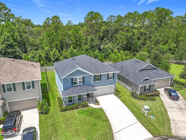 153 Orient Dr, Saint Augustine, FL 32092 - aerial view of property and surrounding area featuring a heavily wooded area