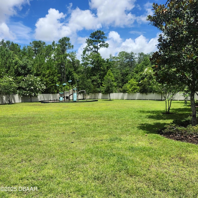153 Orient Dr, Saint Augustine, FL 32092 - fenced backyard with a playground