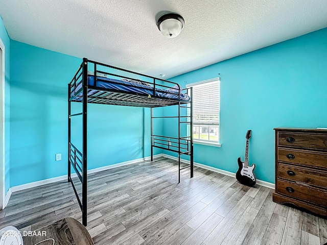 153 Orient Dr, Saint Augustine, FL 32092 - unfurnished bedroom with wood finished floors and a textured ceiling
