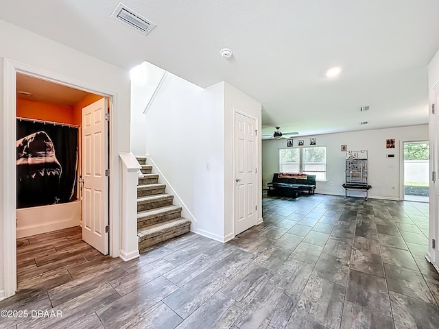 153 Orient Dr, Saint Augustine, FL 32092 - hall with stairs, plenty of natural light, and wood tiled floors