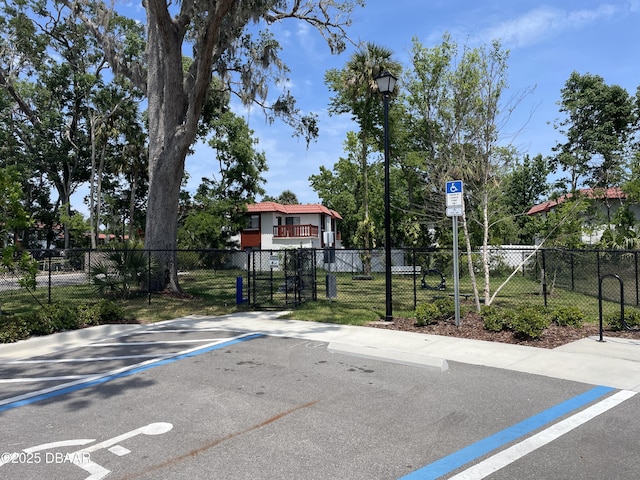 view of basketball court with fence