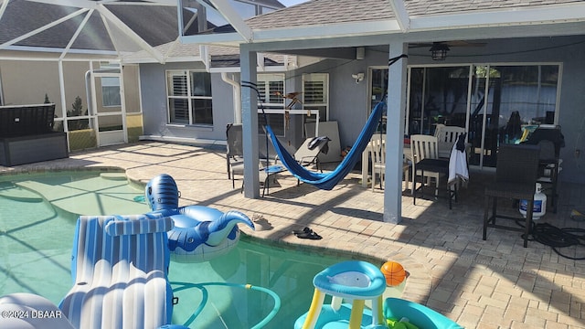 view of patio / terrace with a lanai and ceiling fan