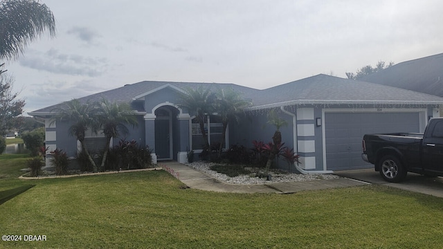 ranch-style house featuring a garage and a front yard