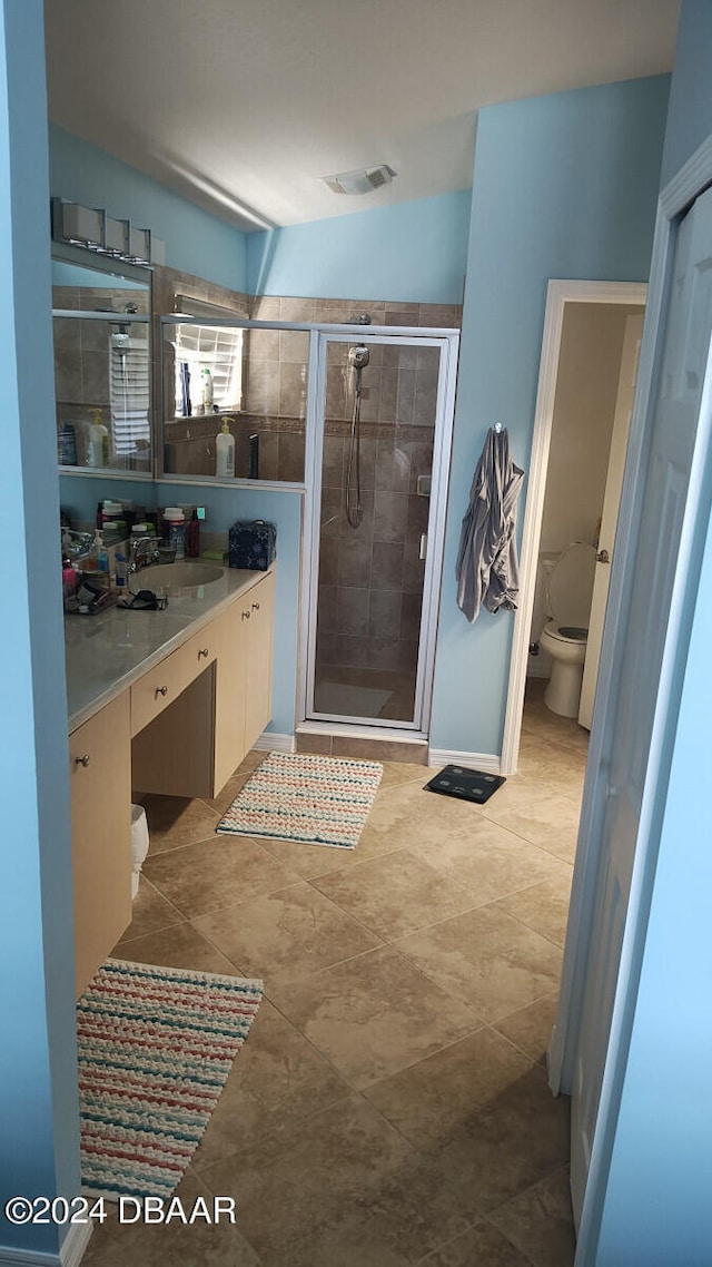 bathroom featuring walk in shower, vanity, and toilet