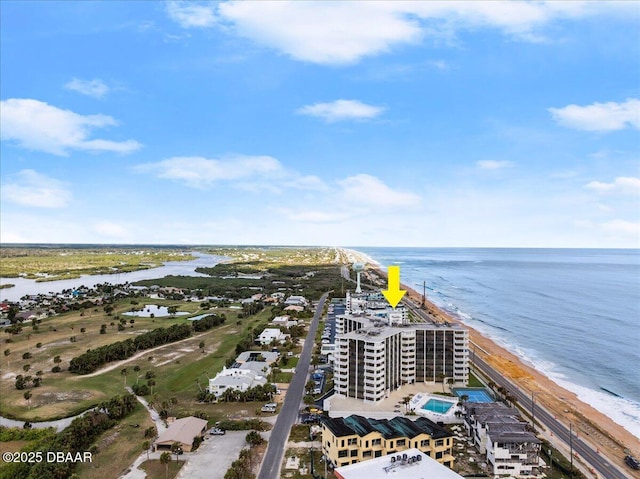 aerial view with a water view and a beach view