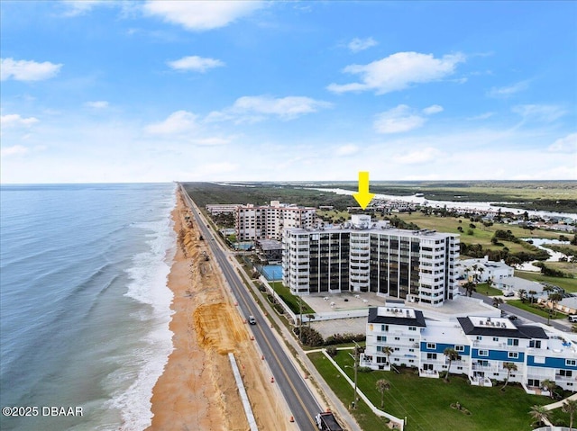 bird's eye view featuring a water view and a view of the beach