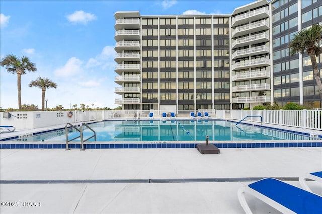 view of swimming pool with a patio